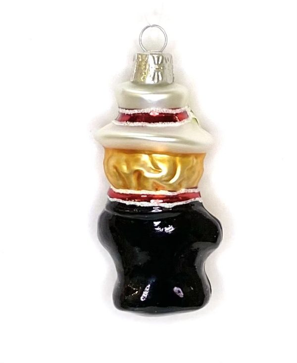 Ёлочная игрушка в виде маленького человечка в чёрной одежде с золотым и белым верхом.