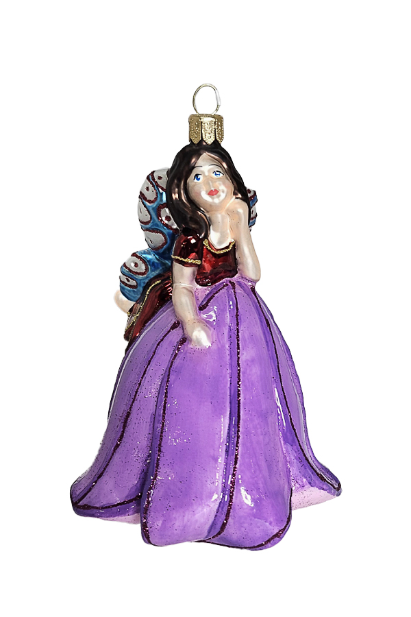 Новогодняя игрушка в виде феи в сиреневом платье.